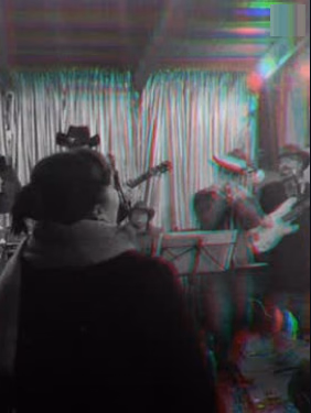 Die Band live vor Publikum, grünes Licht